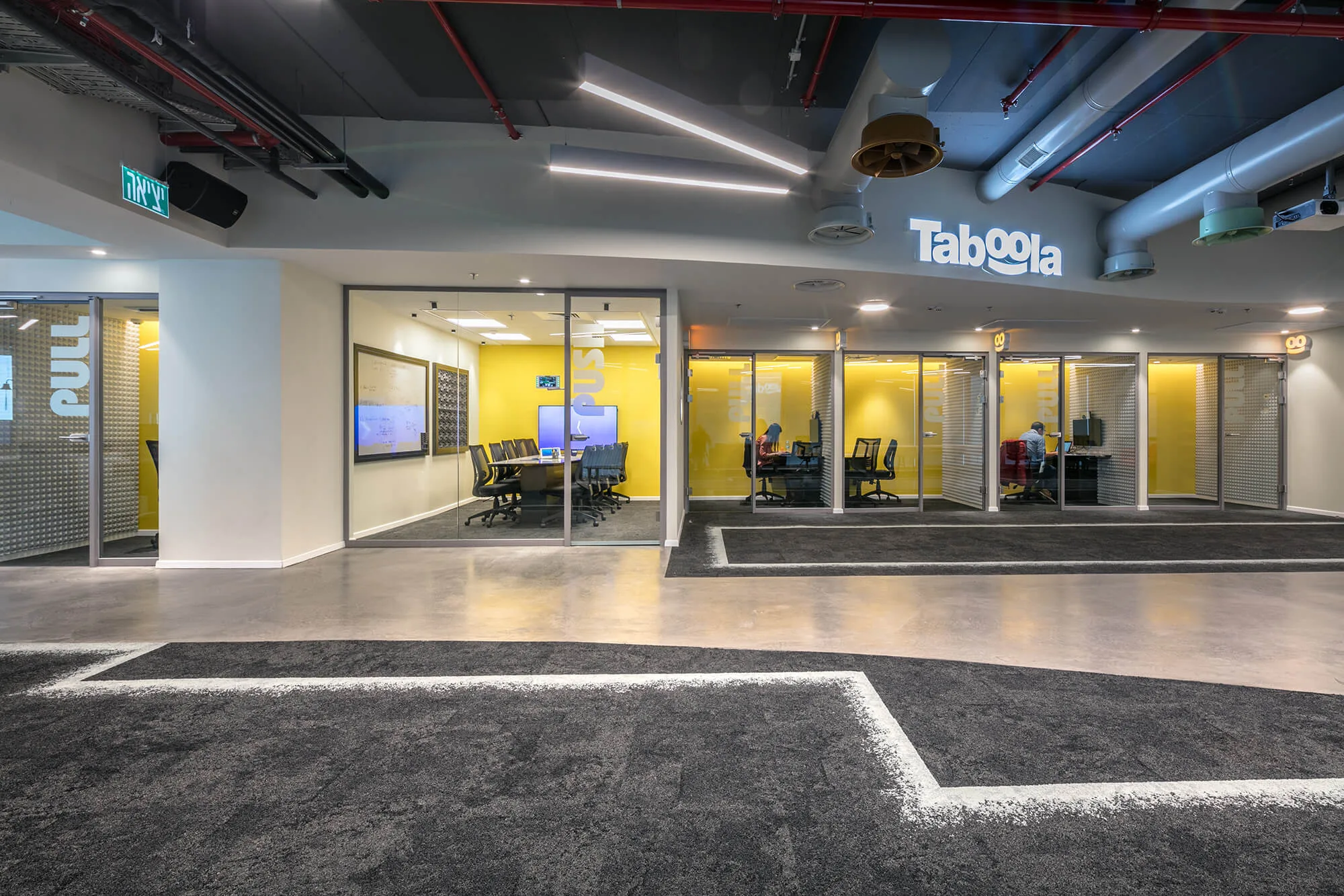 Yellow glazed meeting rooms off the reception area